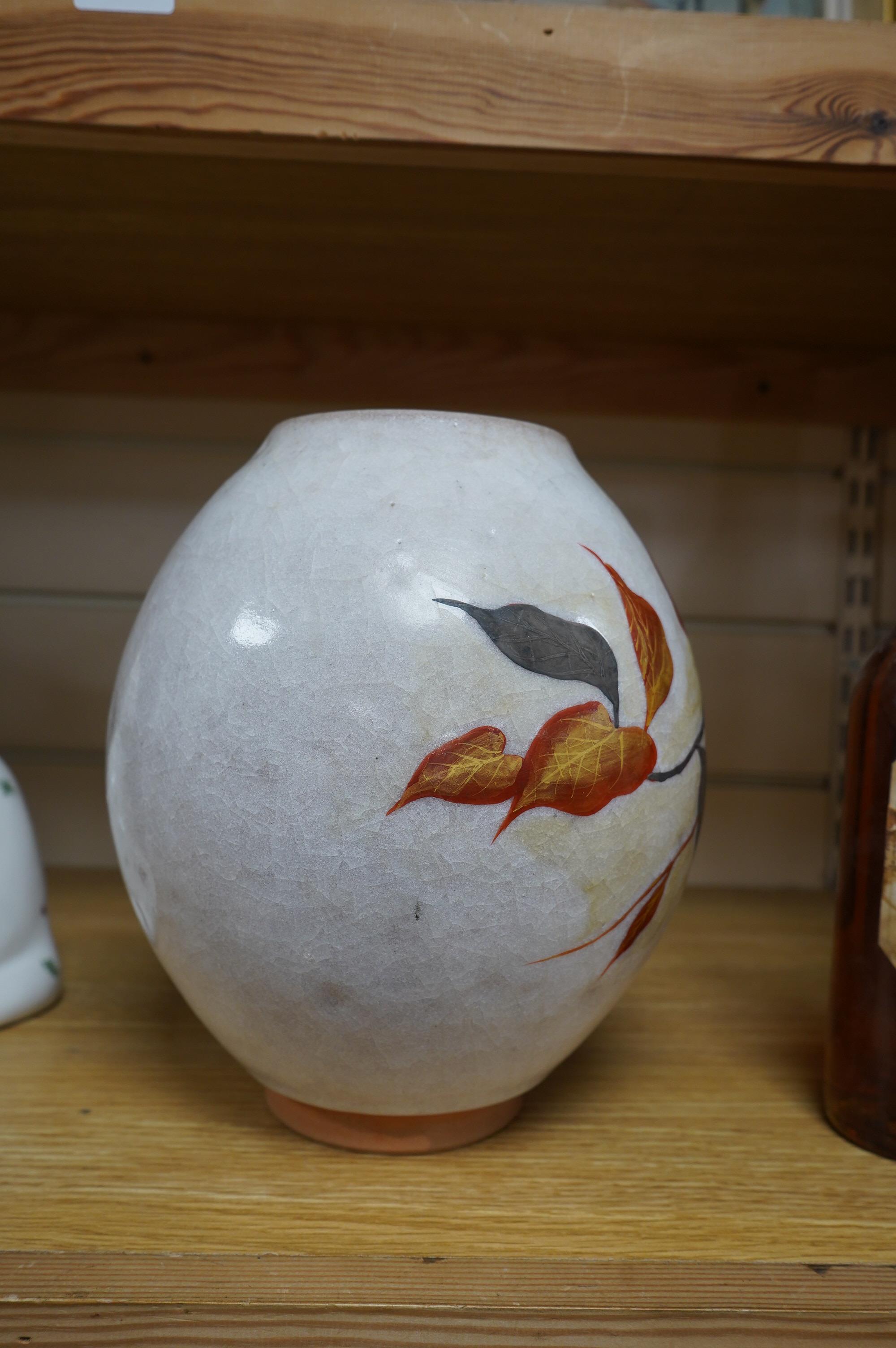 A Chinese terracotta and enamel vase with gilded leaf decoration, seal mark to the base, 23cm high. Condition - good